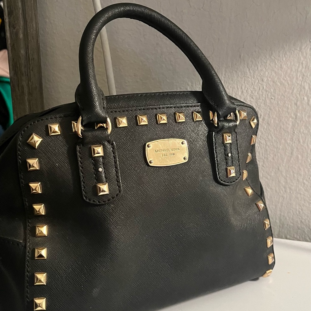 Michael Kors: Black Studded Hand Purse with removable shoulder strap
